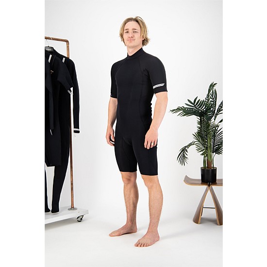 Man wearing black Coastlines wetsuit
