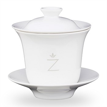 Four piece elegant porcelain tea cup with in-built strainer
